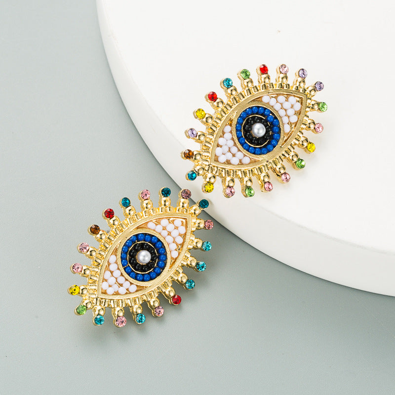 Wholesale Devil's Eye Alloy Inlaid Pearl Color Rhinestone Earrings